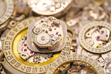 Old mechanical watches with gears and cogs. Watch or clock mechanisms