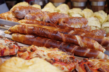 Pizza and other baked goods in bread shop