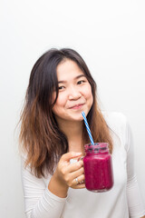 Beautiful healthy women drinking mix berry smoothie healthy food