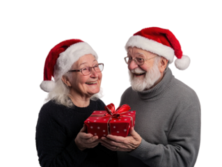 Elderly couple in Santa hats holding a Christmas gift, celebrating joyfully, isolated on white. PNG transparent.