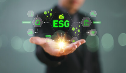 Fototapeta premium ESG concept, sustainable environment society and governance. Green energy sustainability. Person with icon represent green energy, modern eco-friendly technology. Carbon footprint target, net zero