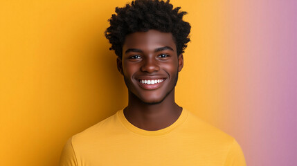 Obraz premium Portrait of happy young black man wearing yellow t-shirt over purple background with copy space