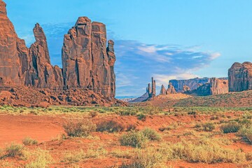 Panoramic picture of the glowing red geological sandstone formations in Monument Valley