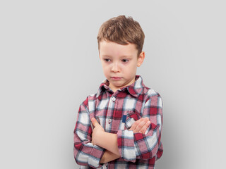 An upset child with a sad expression: Reflecting emotions and vulnerability in difficult childhood moments