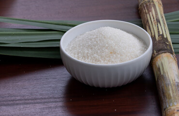 Sweet and Natural – White Sugar in Ceramic Bowl with Cane Leaves