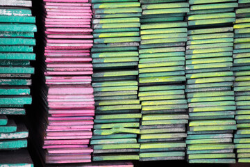 Colorful stacked of steel flat bar as background