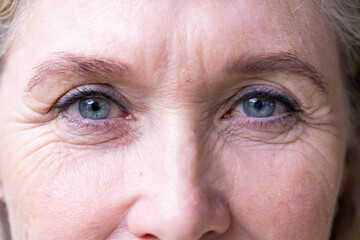 At home, Close-up of senior woman's eyes, showing wrinkles and aging gracefully