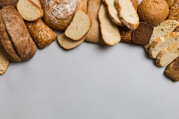 Homemade natural breads. Different kinds of fresh bread as background, top view with copy space