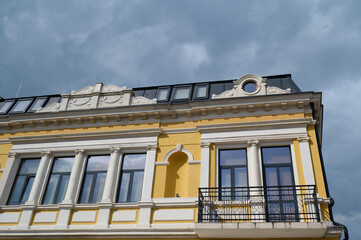 Obraz premium Elegant baroque architecture on a historic building against a cloudy sky, showcasing intricate details in an urban setting, Varna, Bulgaria
