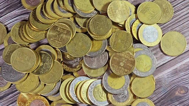 Various Saudi Arabia kingdom coins of different values and times, Old and new Saudi Riyals currency of 2 riyals, 1 riyal, half and quarter of a riyal SAR, Economy, money inflation and growth concept