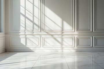 Obraz premium A large, empty room with white walls and white flooring. The room is illuminated by sunlight coming in through the windows