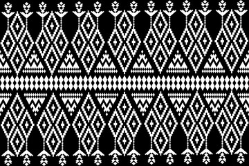 A black and white seamless pattern featuring geometric and floral designs with ethnic and tribal ornaments, creating a vintage, decorative texture perfect for wallpaper or fabric