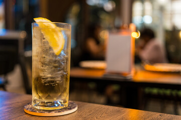 Cocktail, Tom Collins, Front view on table at nigth pub