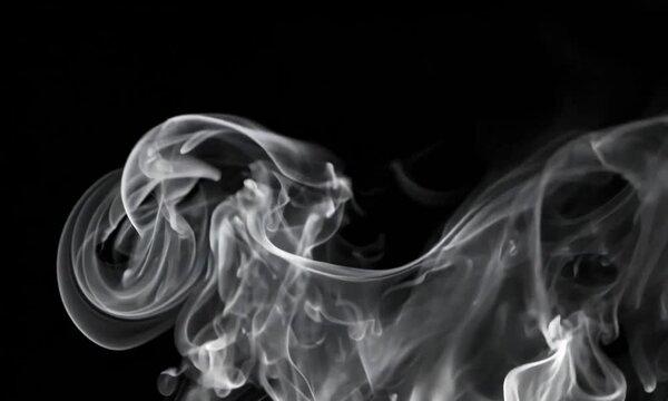 Smoke rises caused by brewing hot coffee poured into a cup.