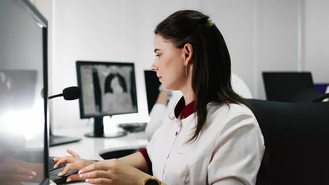 Specialists carefully analyze CT images on a computer in a modern diagnostic center. They provide accurate results and high-quality diagnostics, emphasizing exceptional patient care.
