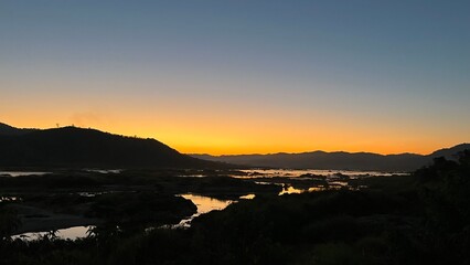 a bright Orange sunset sky.
