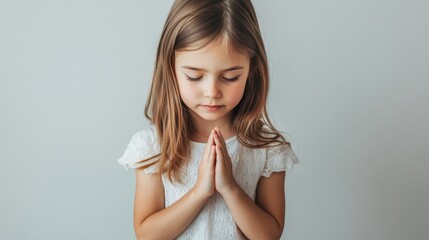 Innocent Girl with Hands in Prayer Pose