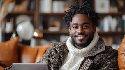 Smiling Man with Dreadlocks Wearing a Brown Coat and White Sweater