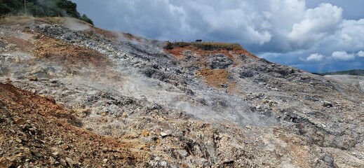 Beautiful view to the hill of sulphur in  Geothermal Natural Park Biancane, Parco Naturalistico Geotermico Delle Biancane, Italy. June 25, 2024.