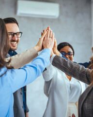 Diverse Team Achieving Success with Unified High Five Gesture