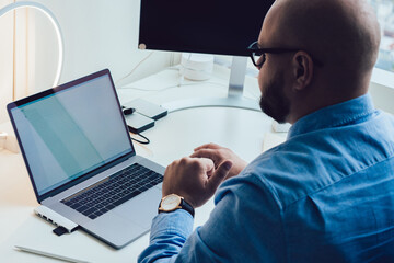 Man working on laptop at table