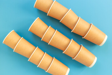 Stack of recyclable coffee paper cups, top view. Eco-friendly zero waste products