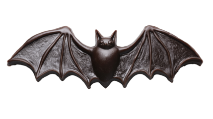 A detailed bat sculpture with outstretched wings, showcasing intricate texture against a black background, perfect for Halloween or decorative purposes., isolated on background.