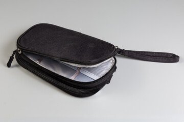 Black small textile soft bag with zippers and wrist strap