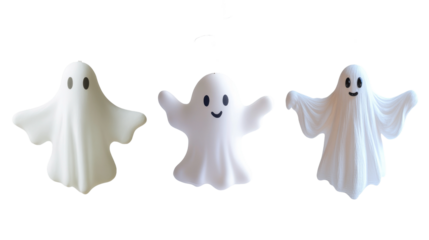 Three playful ghost figures on a black background, each with friendly expressions, ideal for Halloween or fun-themed decorations., isolated on background.