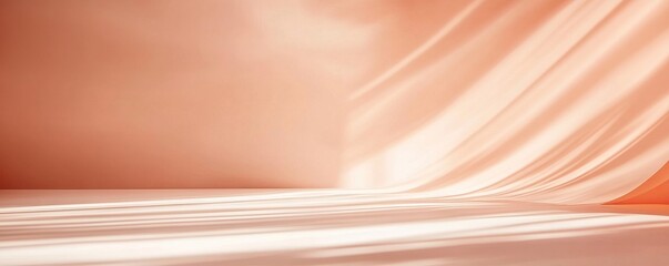 Soft peach-colored fabric drapes elegantly with gentle folds and smooth texture, creating a serene backdrop for various design projects.
