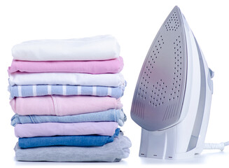 Stack pile of colorful clothes and electric iron on white background isolation