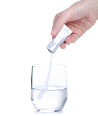 Female hand holding glass of water powder medicine