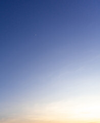 Beautiful morning or evening blue and orange sky while sunsets or sunrises taken at the sea used as natural blackground texture