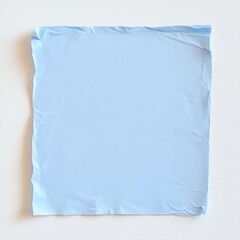 crumpled blank blue paper note on white