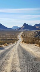 Rugged Desert Road Leading into Distant Mountain Landscape