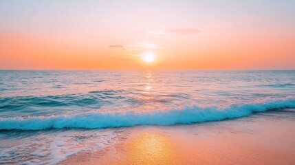 A serene sunset over the ocean, casting warm colors on the water and shoreline.