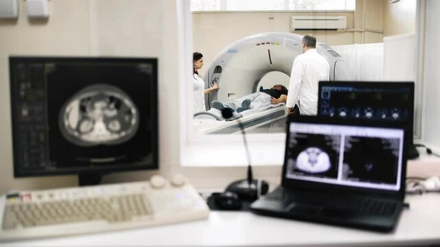 A doctor and a patient are discussing scan results in a modern tomography lab. The doctor explains the findings in detail, fostering a sense of trust and care for the patient's health.