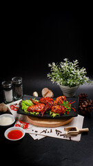 Fried chicken wings and barbecue sauce served on an aesthetic plate, shot from an angle for a subtle food photography composition.