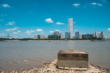 Shanghai's Riverside urban architecture under the blue sky and white clouds.