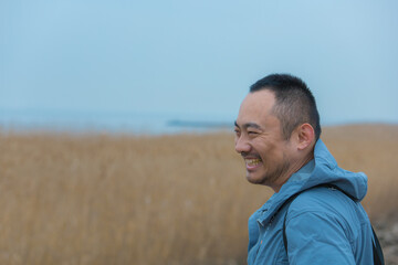 Chongming District, Shanghai - Young people on the beach under the blue sky