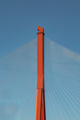 Obraz premium Close-up of a red modern cable-stayed bridge