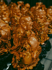group of laughing golden buddha
