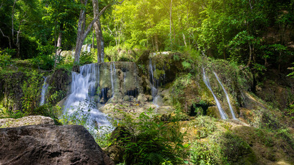 Deep forest waterfall in Thailand. Erawan Waterfall National Park, Kanchanaburi, Thailand.