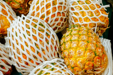 Pineapple on sale in a market