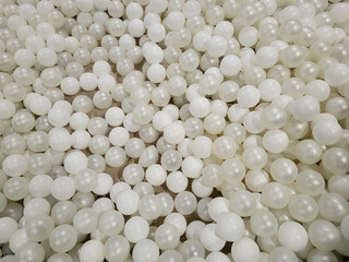 Abstract monochrome decor. The background is made of white balls.