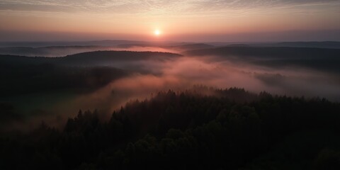Fototapeta premium The sky is orange and the sun is setting. The clouds are white and the sky is hazy