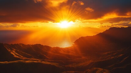 Golden rays of a setting sun over Hawaii's mountains and ocean