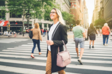 blurred for background. Crowd of people on the street. people walking on the city street. A blurry people walking. Urban, social concept. Abstract urban background with blurred buildings and street.