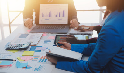 Meeting of business executives discussing analysis of the company's financial situation and business planning with partner collaboration and consultation of strategy.