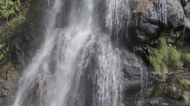 Drone begins at bottom of Cachoeira Andorinha waterfall and rises to the top, in the Parque Nacional da Chapada dos Guimar&atilde;es, Mato Grosso, Brazil
